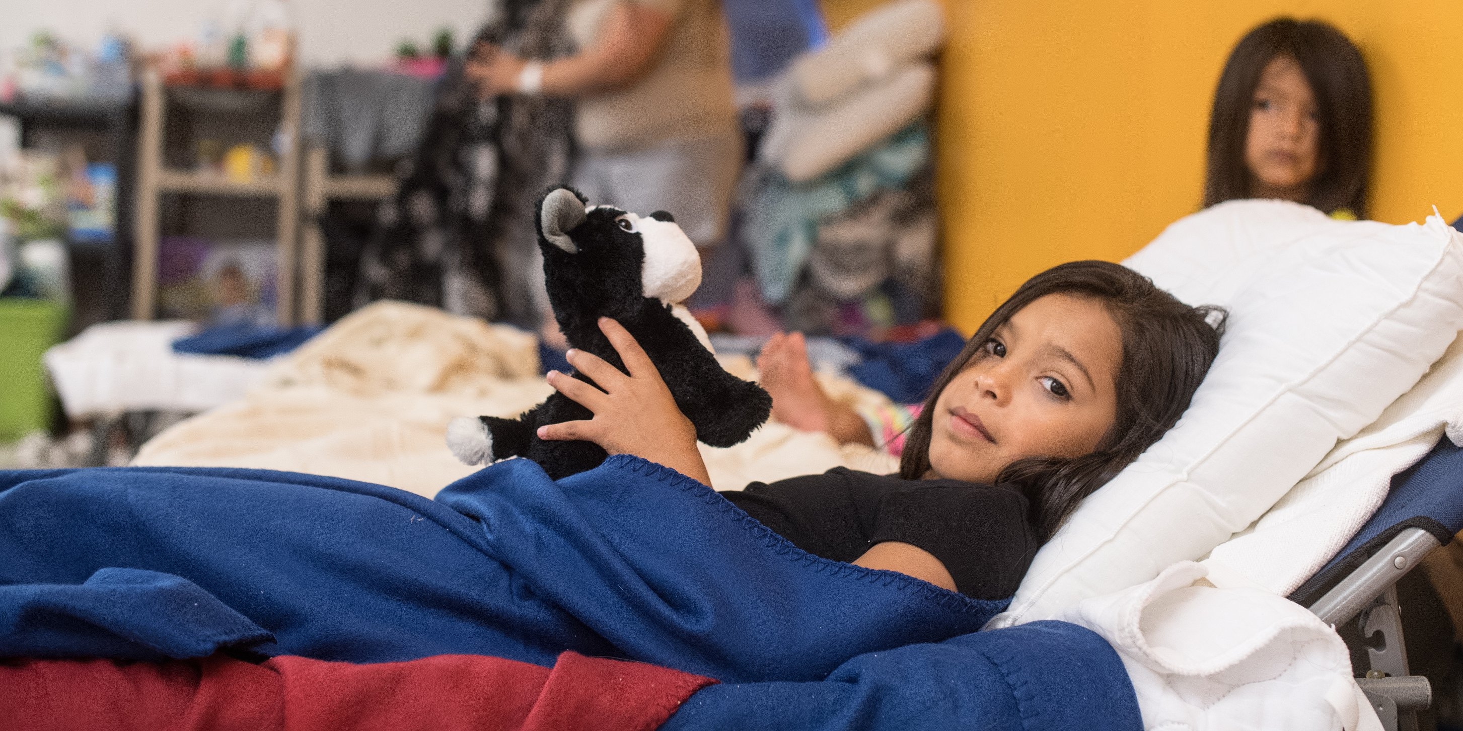 A 9 year-old girl is of 16 extended family members who evacuated together to the shelter for hurrica