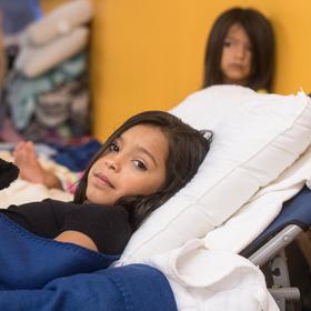 A 9 year-old girl is of 16 extended family members who evacuated together to the shelter for hurrica A 9 year-old girl is of 16 extended family members who evacuated together to the shelter for hurrica