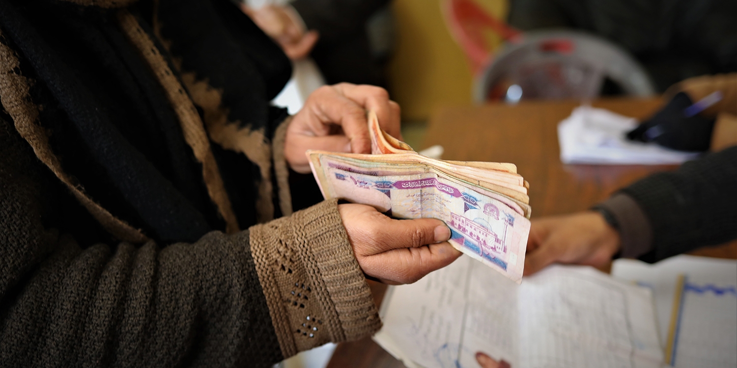 A woman, who has received cash assistance from Save the Children to help her buy essential items including food and clothing through the critical winter months. A woman, who has received cash assistance from Save the Children to help her buy essential items including food and clothing through the critical winter months.