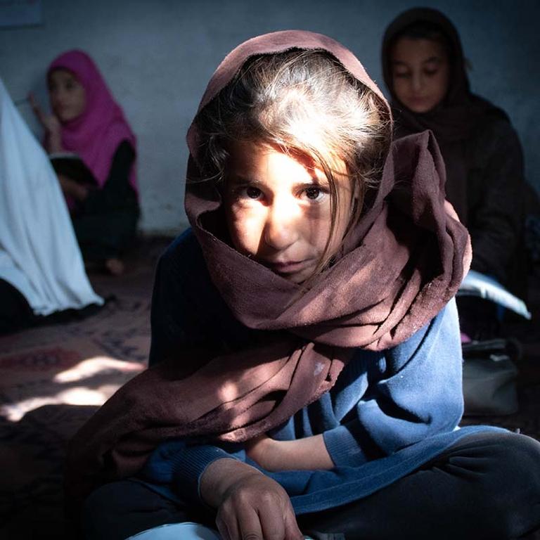 In Afghanistan, a 10-year old girl attends school in a community-based program after her school was closed due to conflict. In Afghanistan, a 10-year old girl attends school in a community-based program after her school was closed due to conflict.