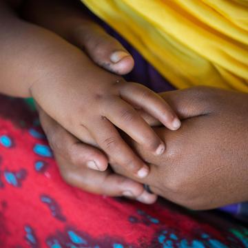 Mom and baby from Somalia holding hands Mom and baby from Somalia holding hands