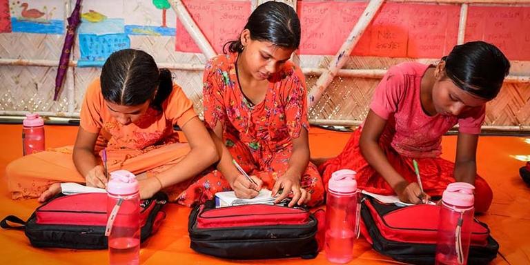 Girls attend the Save the Children learning center in Lambashia Camp Coxs Bazar Girls attend the Save the Children learning center in Lambashia Camp Coxs Bazar