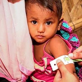 A 22-month old girl is measured with a MUAC band in a Save the Children Health Assessment Centre in Cox’s Bazar, Bangladesh. A 22-month old girl is measured with a MUAC band in a Save the Children Health Assessment Centre in Cox’s Bazar, Bangladesh.