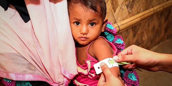 A 22-month old girl is measured with a MUAC band in a Save the Children Health Assessment Centre in Cox’s Bazar, Bangladesh. A 22-month old girl is measured with a MUAC band in a Save the Children Health Assessment Centre in Cox’s Bazar, Bangladesh.
