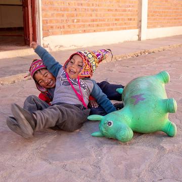 Children play with a toy horse Children play with a toy horse