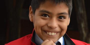 A young boy smiles. A young boy smiles.