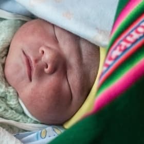 A healthy newborn, a brand new, one-day-old baby, here in his colorful aguayo, and his mother Liseth are alive and thriving, thanks to the support of Save the Children's vital work in Bolivia. Photo Credit: Susan Warner/Save the Children 2015. A healthy newborn, a brand new, one-day-old baby, here in his colorful aguayo, and his mother Liseth are alive and thriving, thanks to the support of Save the Children's vital work in Bolivia. Photo Credit: Susan Warner/Save the Children 2015.