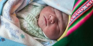 A healthy newborn, a brand new, one-day-old baby, here in his colorful aguayo, and his mother Liseth are alive and thriving, thanks to the support of Save the Children's vital work in Bolivia. Photo Credit: Susan Warner/Save the Children 2015. A healthy newborn, a brand new, one-day-old baby, here in his colorful aguayo, and his mother Liseth are alive and thriving, thanks to the support of Save the Children's vital work in Bolivia. Photo Credit: Susan Warner/Save the Children 2015.