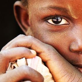 Portait of Nemata, age four, at her home in Kaya, Burkina Faso. Nemata tells Save the Children about her family’s struggle to feed themselves due to last year’s drought and its effect on their crops. “Sometimes I don’t eat enough,” Nemata whispers. The family sold most of their livestock to feed themselves, but with nothing to harvest, Nemata’s family faces hunger. Portait of Nemata, age four, at her home in Kaya, Burkina Faso. Nemata tells Save the Children about her family’s struggle to feed themselves due to last year’s drought and its effect on their crops. “Sometimes I don’t eat enough,” Nemata whispers. The family sold most of their livestock to feed themselves, but with nothing to harvest, Nemata’s family faces hunger.