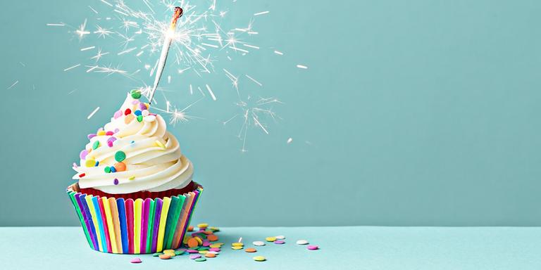 A birthday cake sits on a table. A birthday cake sits on a table.