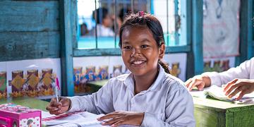 Kanha, 12, at her school on Tonle Sap Lake, Cambodia Kanha, 12, at her school on Tonle Sap Lake, Cambodia