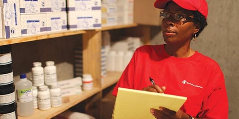 A woman counts health supplies A woman counts health supplies