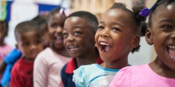 Children smiling in the classroom
