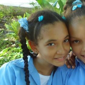 Three school-aged girls attend a Save the Children program at a school in Dajabon, Dominican Republic. Photo credit: Aneliya Nikolova/Save the Children, July 2016. Three school-aged girls attend a Save the Children program at a school in Dajabon, Dominican Republic. Photo credit: Aneliya Nikolova/Save the Children, July 2016.
