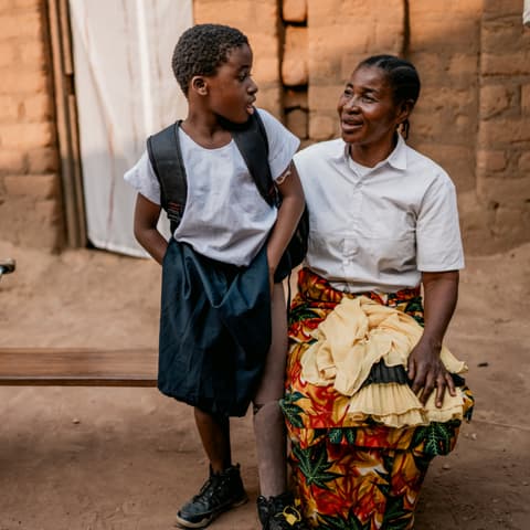 A little girl with a prosthetic leg with her grandmother A little girl with a prosthetic leg with her grandmother