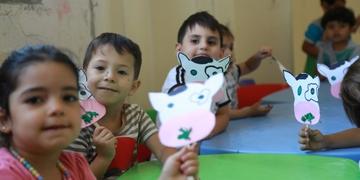 Young children participate in an activity as part of Save the Children's early childhood care and development programming. Young children participate in an activity as part of Save the Children's early childhood care and development programming.
