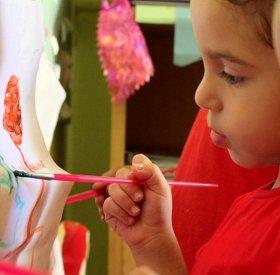 Close-up portrait of two young children painting in a Save the Children-supported art class in Egypt. Photo credit: Save the Children, 2012. Close-up portrait of two young children painting in a Save the Children-supported art class in Egypt. Photo credit: Save the Children, 2012.