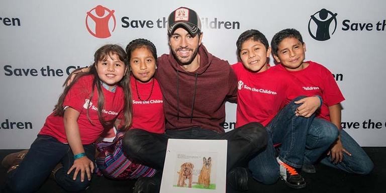 Grammy Award-winning artist Enrique Iglesias has teamed up with Save the Children to raise awareness and funds to provide immediate relief to children after natural disasters and has visited with kids, parents and staff from our programs in the U.S., Guatemala and Mexico. Grammy Award-winning artist Enrique Iglesias has teamed up with Save the Children to raise awareness and funds to provide immediate relief to children after natural disasters and has visited with kids, parents and staff from our programs in the U.S., Guatemala and Mexico.