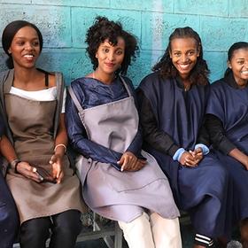 Ethiopia, women with the help of LEEP expanded their shoemaking business smile at the camera. Ethiopia, women with the help of LEEP expanded their shoemaking business smile at the camera.