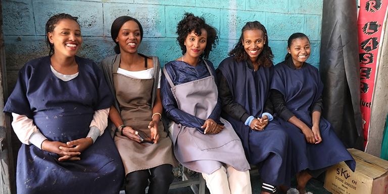 Ethiopia, women with the help of LEEP expanded their shoemaking business smile at the camera. Ethiopia, women with the help of LEEP expanded their shoemaking business smile at the camera.