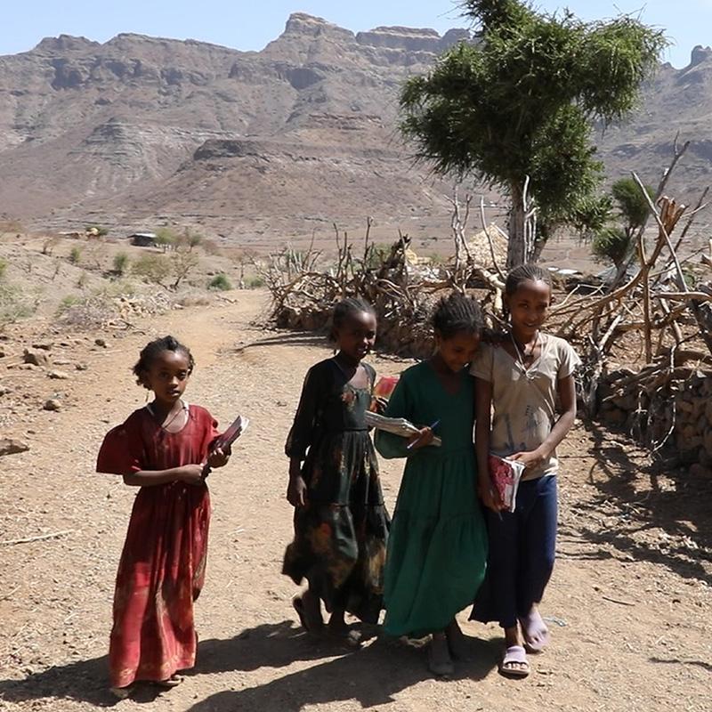 Four girls walk home from school in drought-ridden Ethiopia