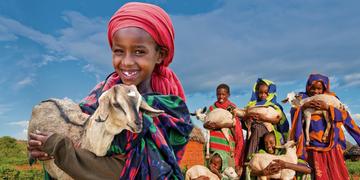 A young Ethiopian girl holds her precious goat to support the Save the Children Gift Catalog. Photo Credit: Gary Dowd/Save the Children 2010. A young Ethiopian girl holds her precious goat to support the Save the Children Gift Catalog. Photo Credit: Gary Dowd/Save the Children 2010.