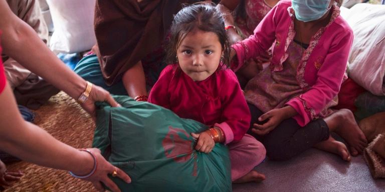 A girl from Nepal sits in her home A girl from Nepal sits in her home