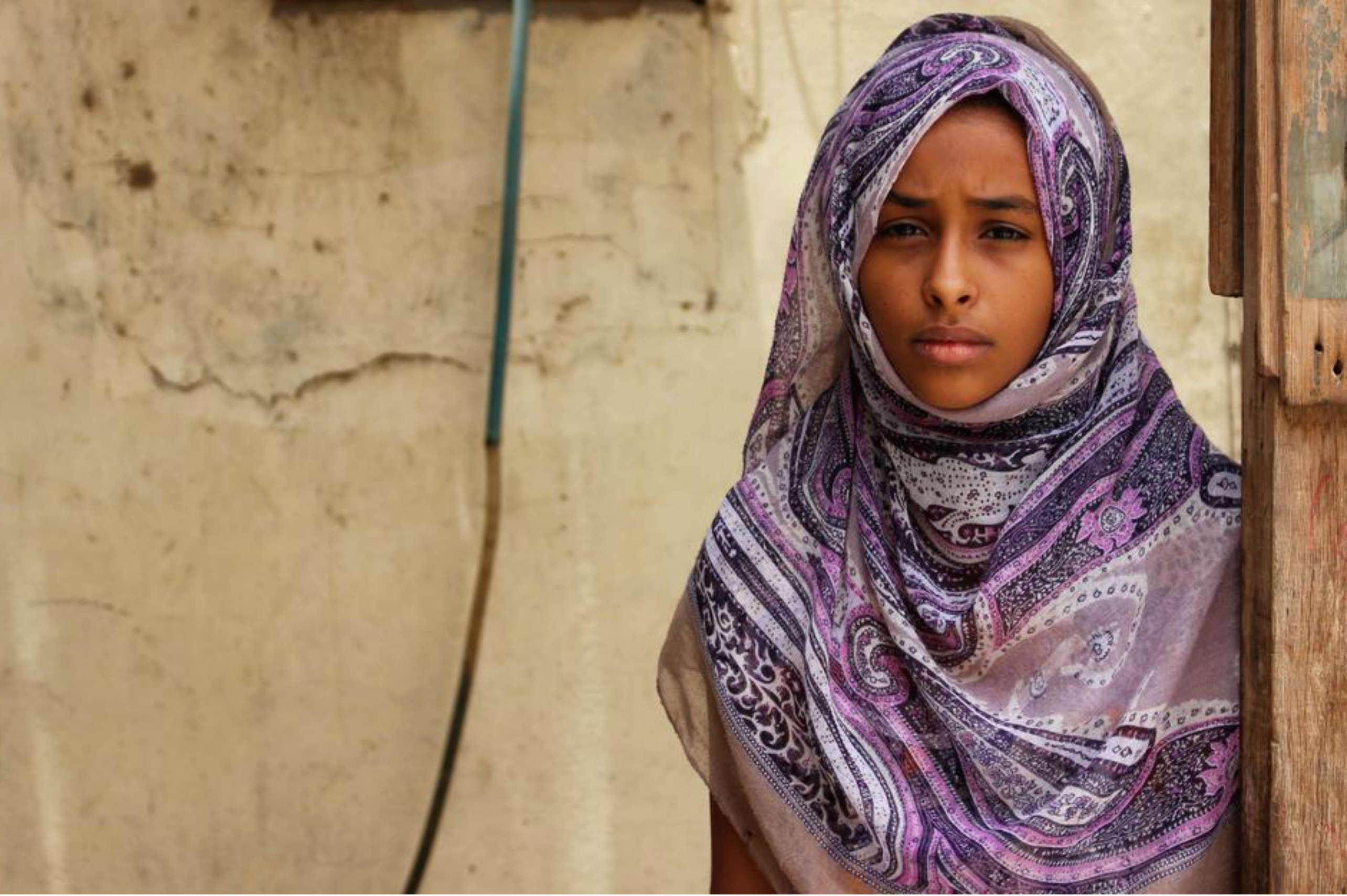 Hanan* stands outside her home in Aden, southern Yemen