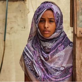 Hanan* stands outside her home in Aden, southern Yemen Hanan* stands outside her home in Aden, southern Yemen