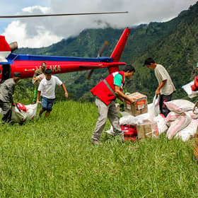 Helicopter discharge of Save the Childrens shelter and WASH assistance material by staff members and Helicopter discharge of Save the Childrens shelter and WASH assistance material by staff members and