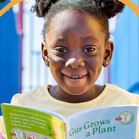 A girl enjoys a picture book. A girl enjoys a picture book.