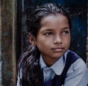 A girl of 9 lives with her mother, father and eight siblings in a small shanty in the slums positioned directly next to the railway tracks of New Delhi, India. She regularly attends a Save the Children learning center, and dreams of being a dancer when she grows up. Photo Credit: CJ Clarke/Save the Children 2014. A girl of 9 lives with her mother, father and eight siblings in a small shanty in the slums positioned directly next to the railway tracks of New Delhi, India. She regularly attends a Save the Children learning center, and dreams of being a dancer when she grows up. Photo Credit: CJ Clarke/Save the Children 2014.