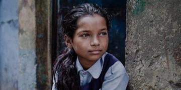 A girl of 9 lives with her mother, father and eight siblings in a small shanty in the slums positioned directly next to the railway tracks of New Delhi, India. She regularly attends a Save the Children learning center, and dreams of being a dancer when she grows up. Photo Credit: CJ Clarke/Save the Children 2014. A girl of 9 lives with her mother, father and eight siblings in a small shanty in the slums positioned directly next to the railway tracks of New Delhi, India. She regularly attends a Save the Children learning center, and dreams of being a dancer when she grows up. Photo Credit: CJ Clarke/Save the Children 2014.