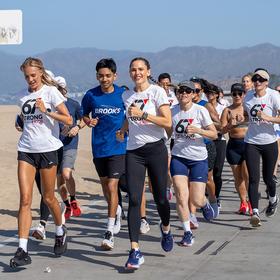 Jen Garner and Becs Gentry lead a crowd of runners for the last mile of the #67Strong4Kids challenge. Jen Garner and Becs Gentry lead a crowd of runners for the last mile of the #67Strong4Kids challenge.