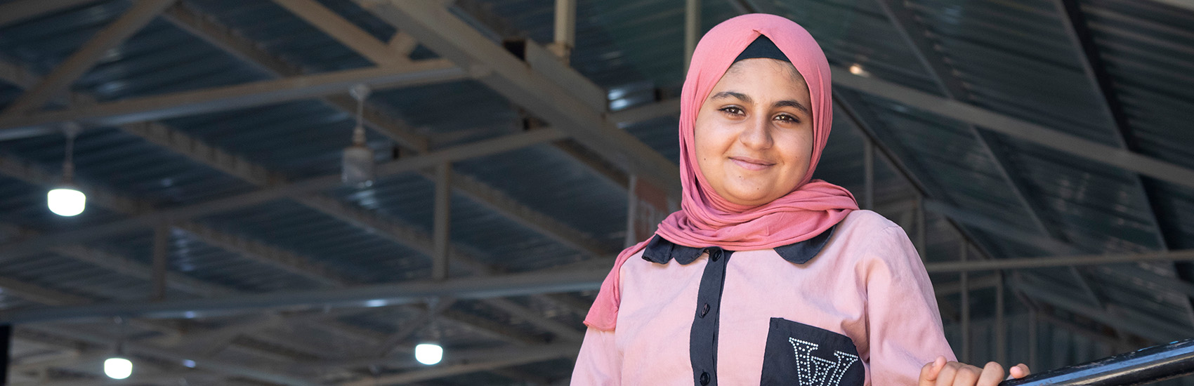 A portrait of Eva*, 15, at a Girls Empowerment Center, run by Save the Children, in Zaatari Refugee Camp, Jordan.