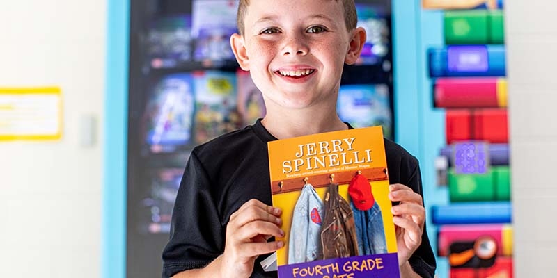 6 yr. old boy in Kentucky holding up a book from a book vending machine 6 yr. old boy in Kentucky holding up a book from a book vending machine