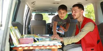 A team in Lebanon are part of a mobile library run out of a van. A team in Lebanon are part of a mobile library run out of a van.