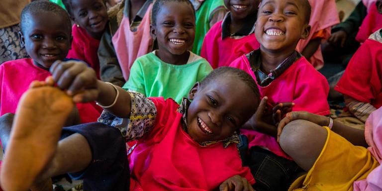 A group of smiling children. A group of smiling children.