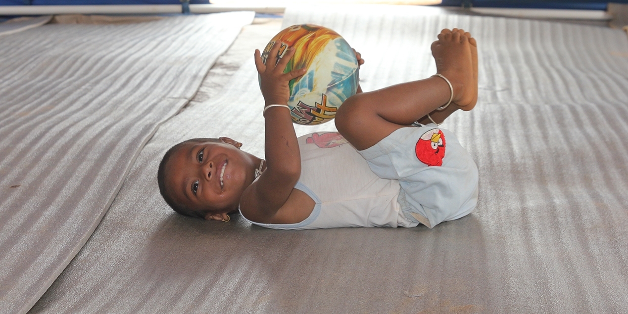 A child of two playing at a Save the Children child-friendly safe space in Nepal. He was trapped in the rubble of his home after the Nepal earthquake and is now on the road to recovery. Photo Credit: Sandy Maroun/Save the Children, June 2015. A child of two playing at a Save the Children child-friendly safe space in Nepal. He was trapped in the rubble of his home after the Nepal earthquake and is now on the road to recovery. Photo Credit: Sandy Maroun/Save the Children, June 2015.