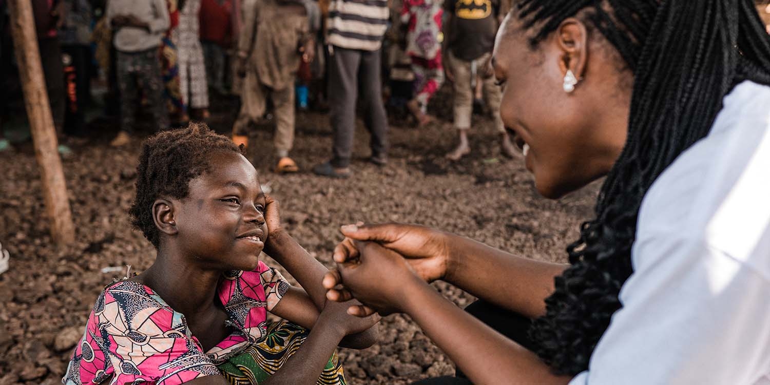 Congo, a little girl is seen with a Child Friendly Space facilitator. Congo, a little girl is seen with a Child Friendly Space facilitator.