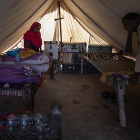Pakistan, a family's house that was destroyed in the Pakistan floods, now lives with his wife and five children in a tent provided by Save the Children. Pakistan, a family's house that was destroyed in the Pakistan floods, now lives with his wife and five children in a tent provided by Save the Children.