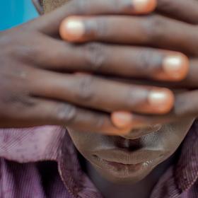 16 year old child in South Sudan covers eyes and has tested positive for HIV and been travelling to a hospital for treatment for several years. 16 year old child in South Sudan covers eyes and has tested positive for HIV and been travelling to a hospital for treatment for several years.