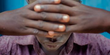 16 year old child in South Sudan covers eyes and has tested positive for HIV and been travelling to a hospital for treatment for several years. 16 year old child in South Sudan covers eyes and has tested positive for HIV and been travelling to a hospital for treatment for several years.