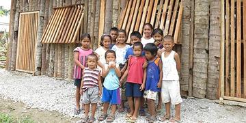 A group of young children stand outside their newly opened Child-Friendly Space constructed by Save the Children in a small mountain village near where Typhoon Haiyan made landfall in 2013. Child-Friendly Spaces provide a safe place for children to play and learn as their communities recover from the devastating effects of natural disasters. Photo credit: Save the Children A group of young children stand outside their newly opened Child-Friendly Space constructed by Save the Children in a small mountain village near where Typhoon Haiyan made landfall in 2013. Child-Friendly Spaces provide a safe place for children to play and learn as their communities recover from the devastating effects of natural disasters. Photo credit: Save the Children