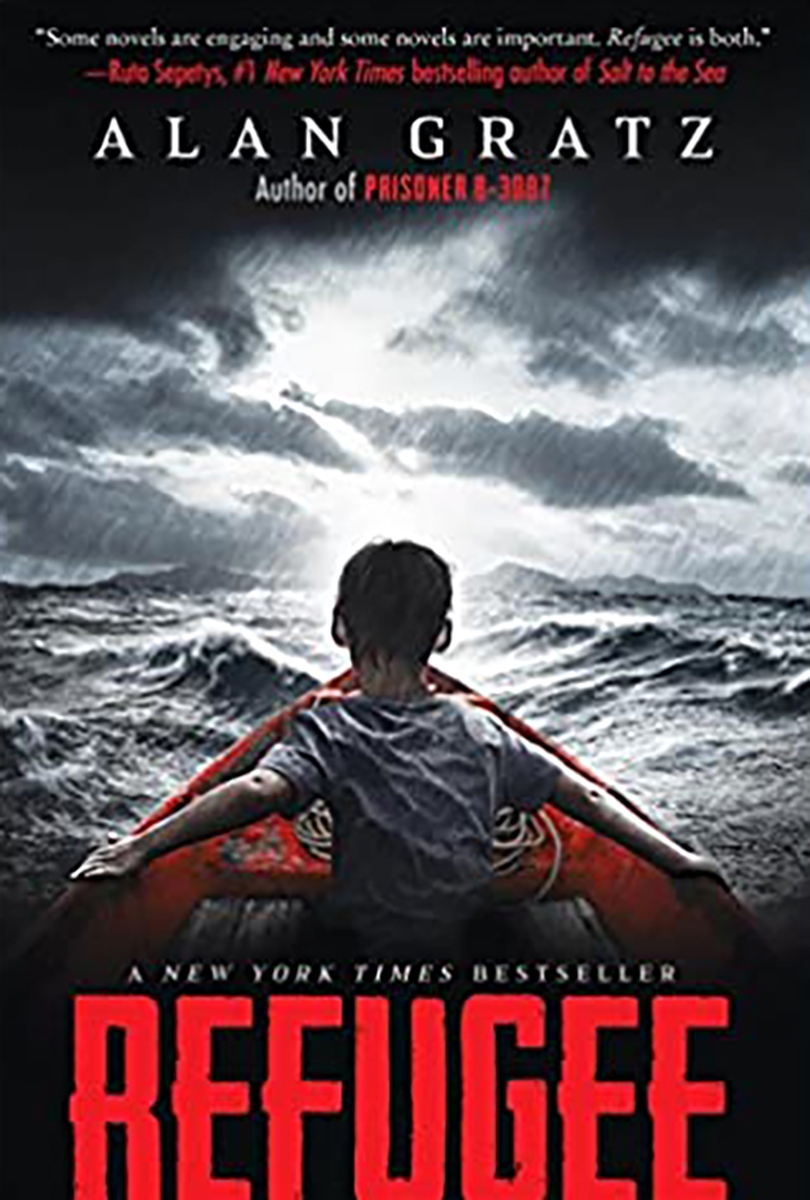 Celebrating World Refugee Day, Refugee book cover shows a scene of a little boy in a red boat in open waters during a storm. Celebrating World Refugee Day, Refugee book cover shows a scene of a little boy in a red boat in open waters during a storm.