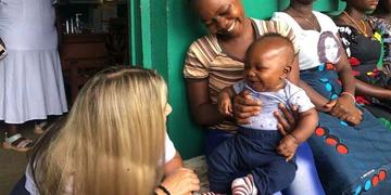 100 Strong member and Save the Children Trustee Corinne Basler joined a trip to Sierra Leone in February 2023. 100 Strong member and Save the Children Trustee Corinne Basler joined a trip to Sierra Leone in February 2023.