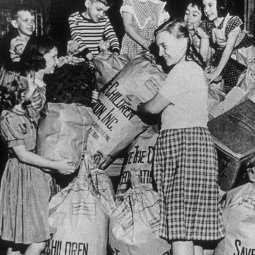 Save the Children's first annual “Bundle Days” campaign was organized in Knoxville, Tennessee 1941, where volunteers refurbished and distributed donated clothing to needy children in the United States and war-affected Europe. Photo Credit Save the Children Archive 1941. Save the Children's first annual “Bundle Days” campaign was organized in Knoxville, Tennessee 1941, where volunteers refurbished and distributed donated clothing to needy children in the United States and war-affected Europe. Photo Credit Save the Children Archive 1941.