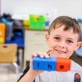 In a classroom in rural America, a 6-year-old boy assembles letter blocks to spell out one of his sight words 'the' during a classroom activity in an Kentucky school. In a classroom in rural America, a 6-year-old boy assembles letter blocks to spell out one of his sight words 'the' during a classroom activity in an Kentucky school.