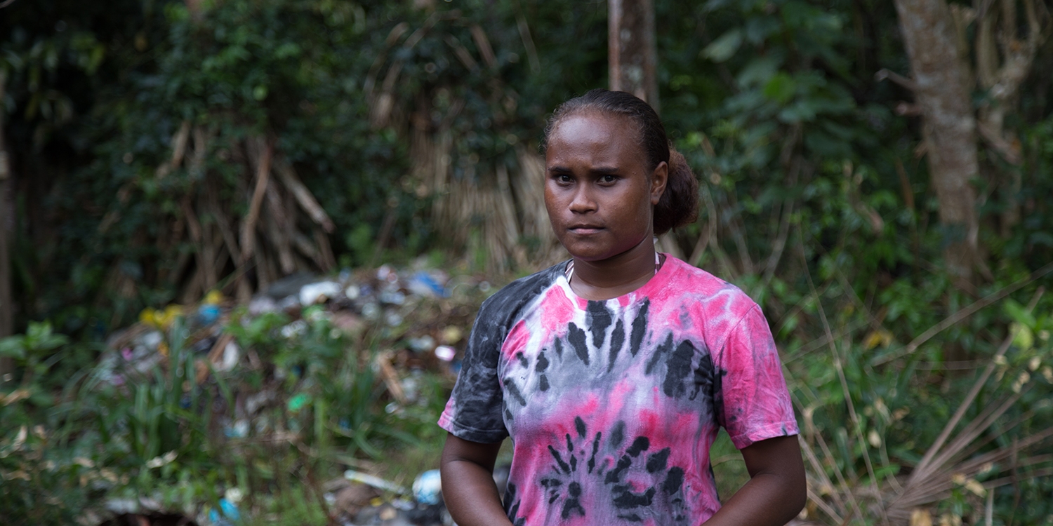 Solomon Islands, a girl in a pink shirt shows the remaining debris following high sea levels near her home. Solomon Islands, a girl in a pink shirt shows the remaining debris following high sea levels near her home.