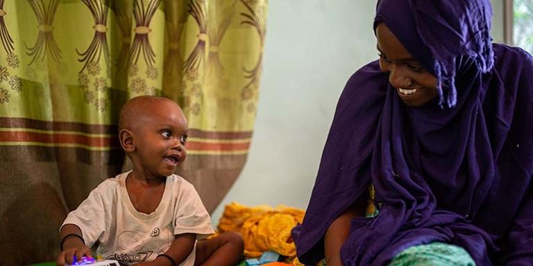 Somalia, a nine month old sits with his mother as he is treated for severe acute malnutrition at a hospital in Somalia. Somalia, a nine month old sits with his mother as he is treated for severe acute malnutrition at a hospital in Somalia.